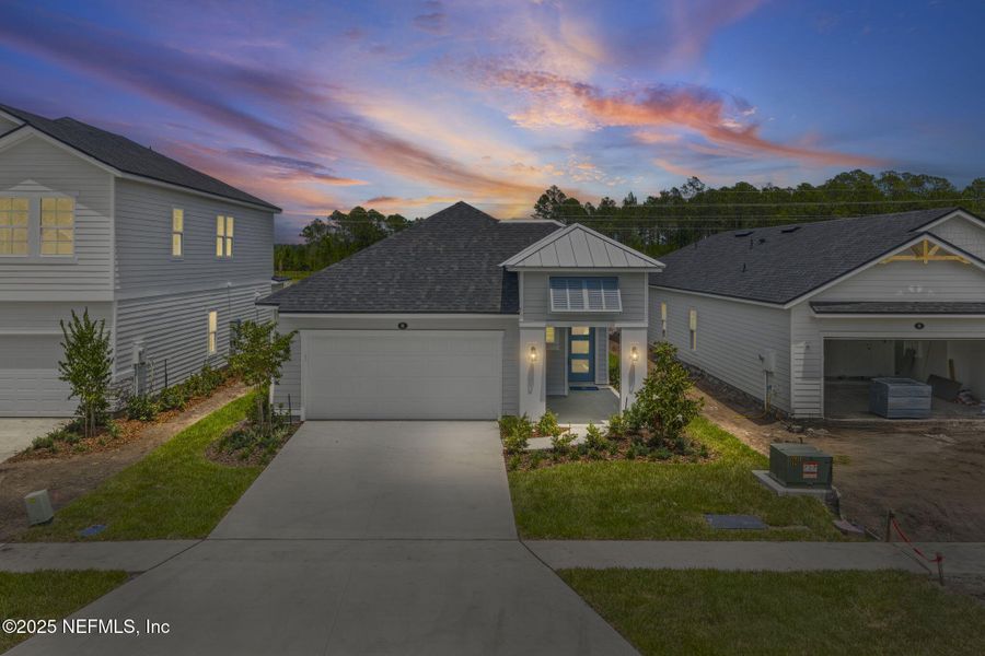 Front exterior of a new home in Beacon Lake, St. Augustine, FL, highlighting curb appeal (Image 20).
