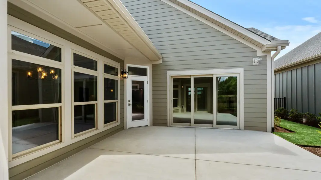 Exterior details and patio area of a home in Courtyards by Carrell, Ocean Isle Beach (Image 4). Exterior details and patio area of a home in Courtyards by Carrell, Ocean Isle Beach (Image 4).