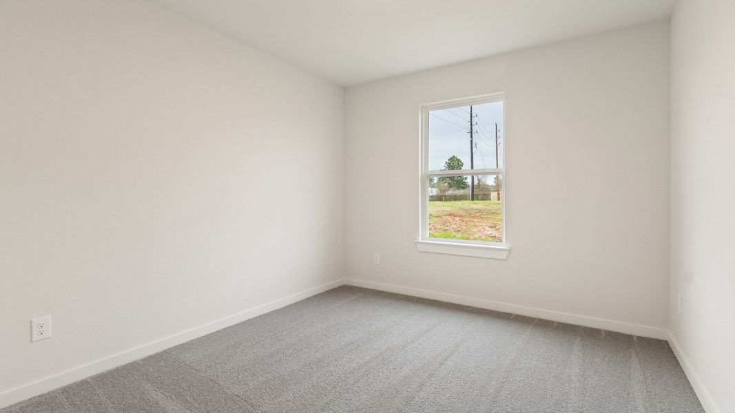 Representative furnished interior of a home built from the Driskill by Brightland Homes in Sunterra, Katy (Image 12).