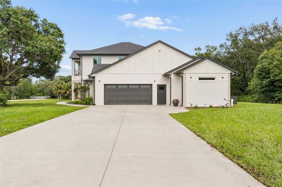 Front exterior of a new home in , New Port Richey, FL, highlighting curb appeal (Image 27).