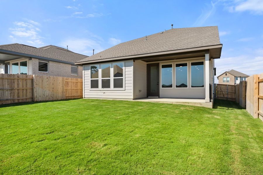 Exterior details and patio area of a home in Lariat, Liberty Hill (Image 27).