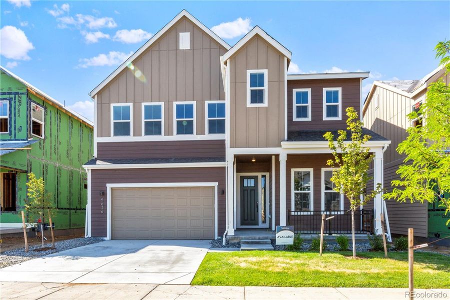 Front exterior of a new home in Dillon Pointe - Journey, Westminster, CO, highlighting curb appeal (Image 1).