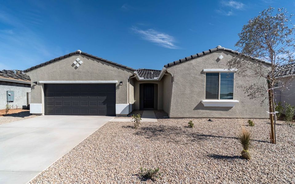 Front exterior of a new home in Rancho Mirage, Maricopa, AZ, highlighting curb appeal (Image 2). Front exterior of a new home in Rancho Mirage, Maricopa, AZ, highlighting curb appeal (Image 2).