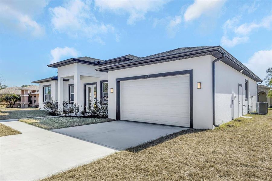 Front exterior of a new home in , Hudson, FL, highlighting curb appeal (Image 32).