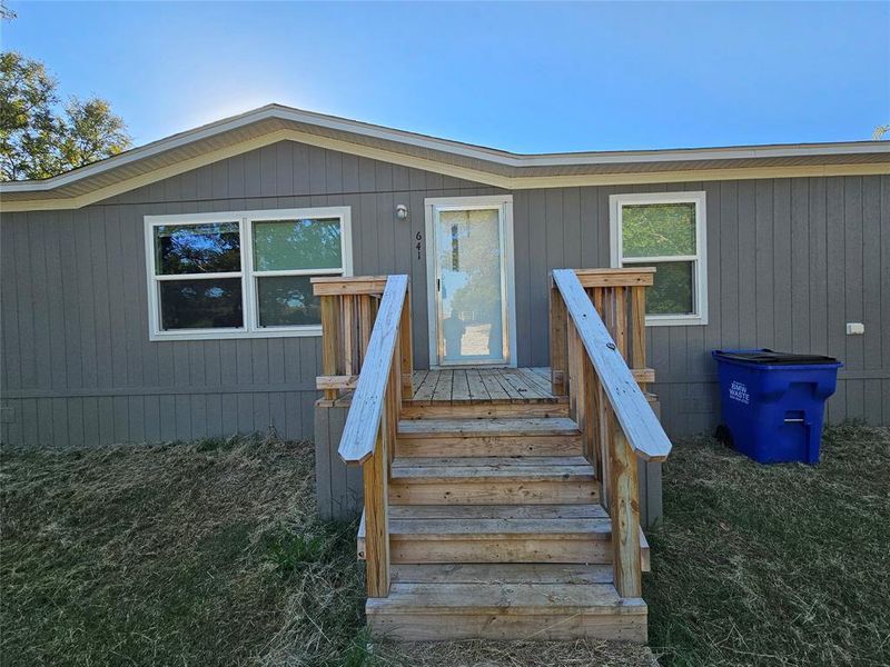 Entrance to property featuring a deck Entrance to property featuring a deck