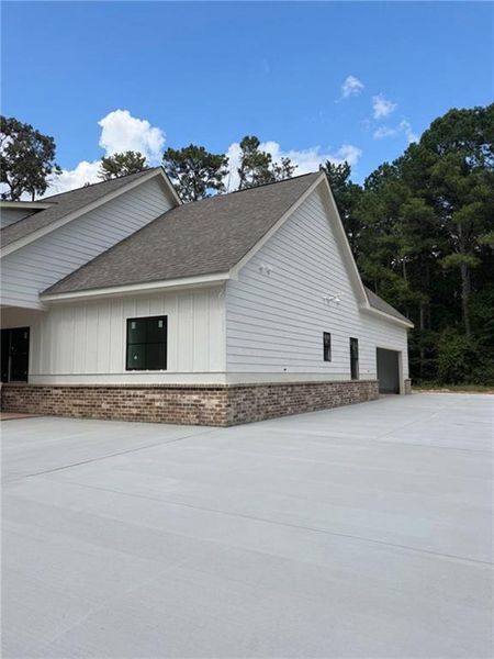 Front exterior of a new home in , Monroe, GA, highlighting curb appeal (Image 1). Front exterior of a new home in , Monroe, GA, highlighting curb appeal (Image 1).