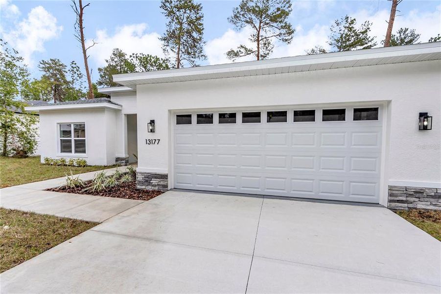 Front exterior of a new home in , Ocala, FL, highlighting curb appeal (Image 23).
