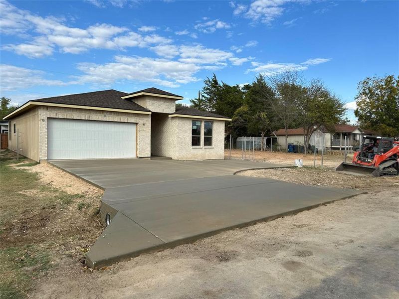 View of front facade featuring a garage