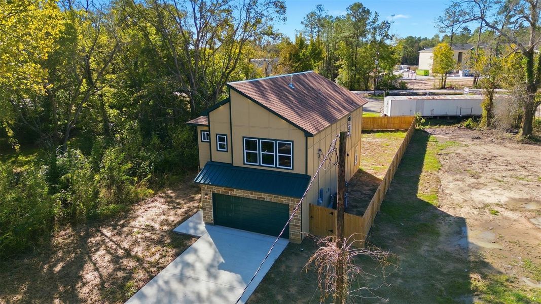 Front exterior of a new home in , Cleveland, TX, highlighting curb appeal (Image 1).