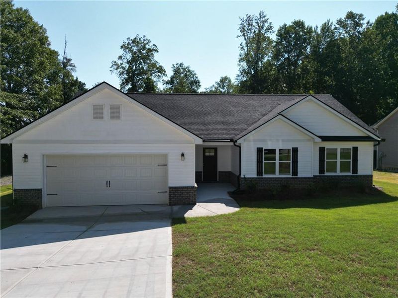 Front exterior of a new home in , Temple, GA, highlighting curb appeal (Image 15). Front exterior of a new home in , Temple, GA, highlighting curb appeal (Image 15).