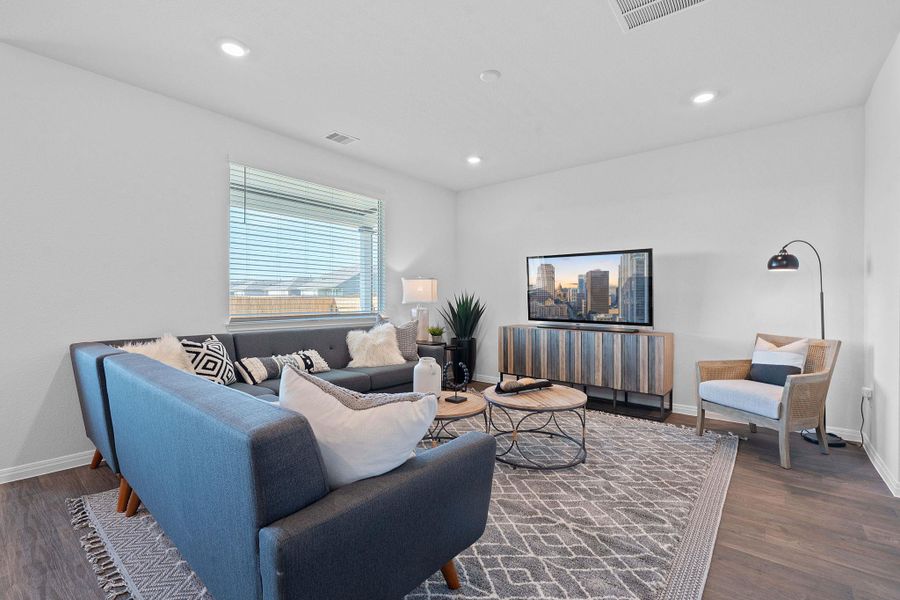 Living room featuring recessed lighting and dark wood finished floors Living room featuring recessed lighting and dark wood finished floors