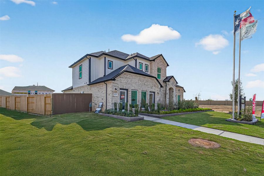 Front exterior of a new home in Rates starting as low as, Iowa Colony, TX, highlighting curb appeal (Image 22).