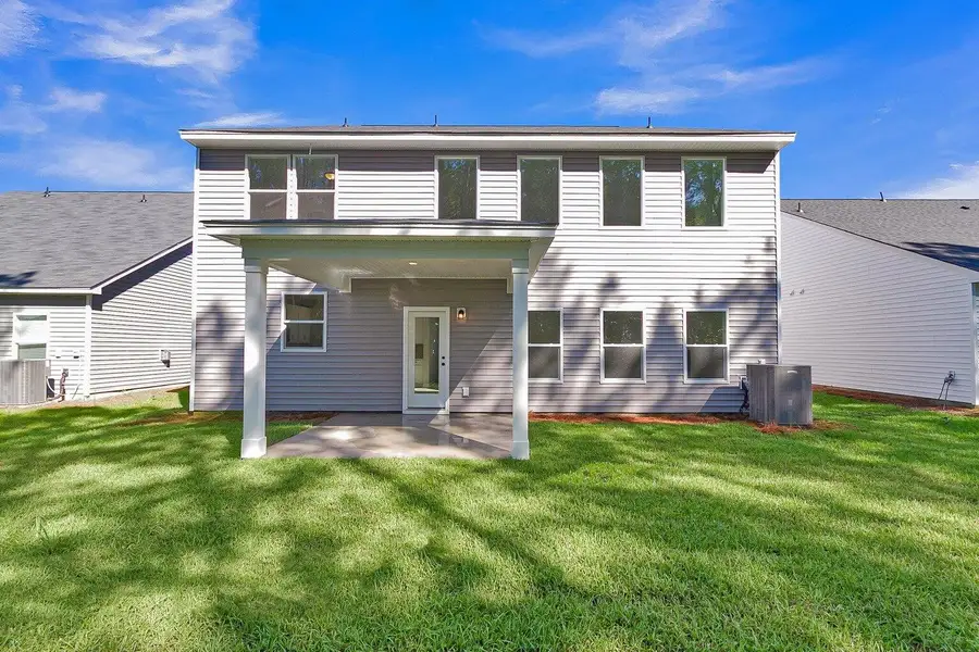 Front exterior of a new home in , Ravenel, SC, highlighting curb appeal (Image 3).