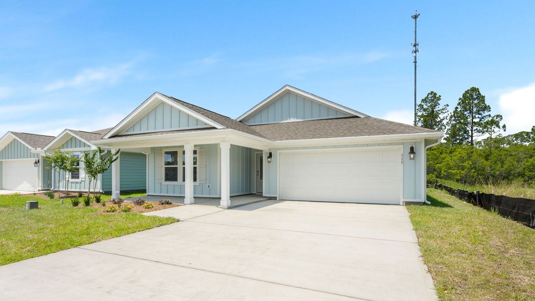 Front exterior of a new home in Palmetto Bluff, Port Saint Joe, FL, highlighting curb appeal (Image 18). Front exterior of a new home in Palmetto Bluff, Port Saint Joe, FL, highlighting curb appeal (Image 18).