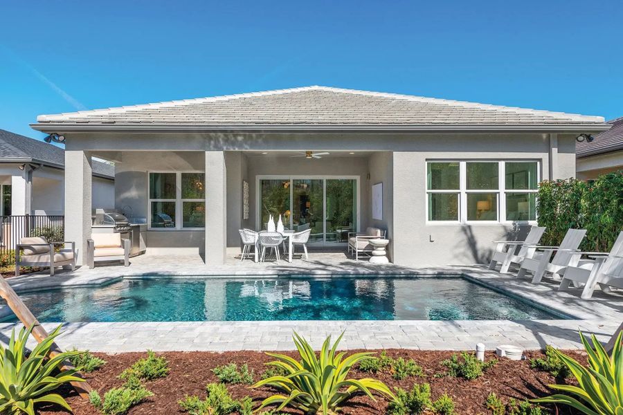 Exterior details and patio area of a home in Valencia Ridge, Wesley Chapel (Image 3).