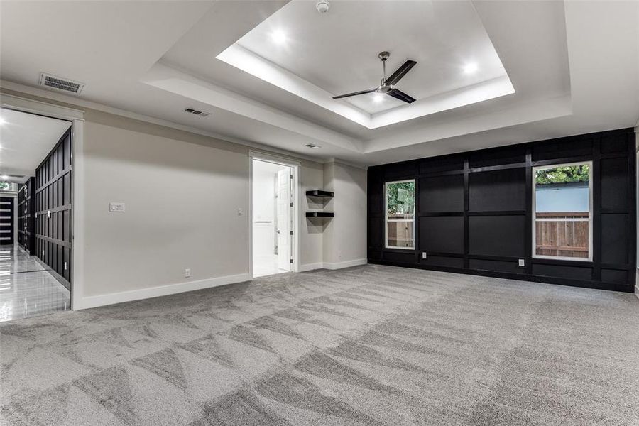 Massif Master bedroom with Accent Walls, Double Tray Ceilings, Shelves and French doors to a Massif Master bedroom that has a free standing tub and his and her separate walk-in-closets!!!