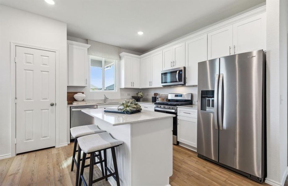 Bright kitchen with ample cabinet space 
 *Photos of furnished model. Not actual home. Representative of floor plan. Some options and features may vary