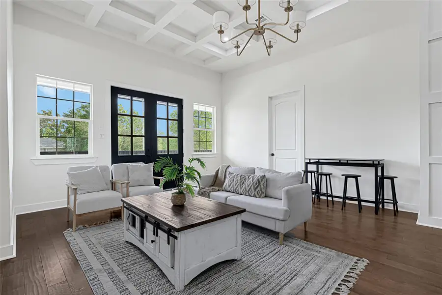 Flooded with natural light, this inviting space offers warmth and brightness.