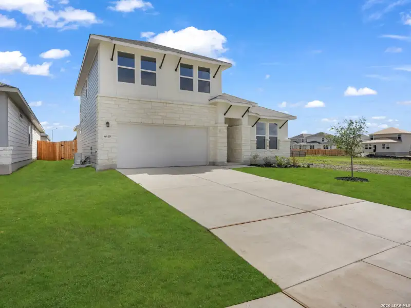 Front exterior of a new home in Morgan Meadows, San Antonio, TX, highlighting curb appeal (Image 2).