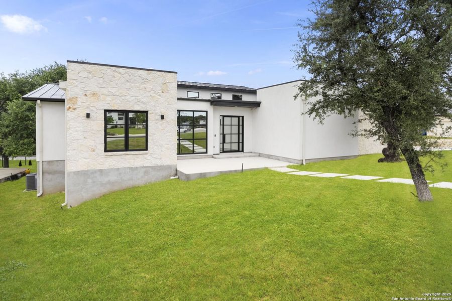 Front exterior of a new home in , San Antonio, TX, highlighting curb appeal (Image 23).