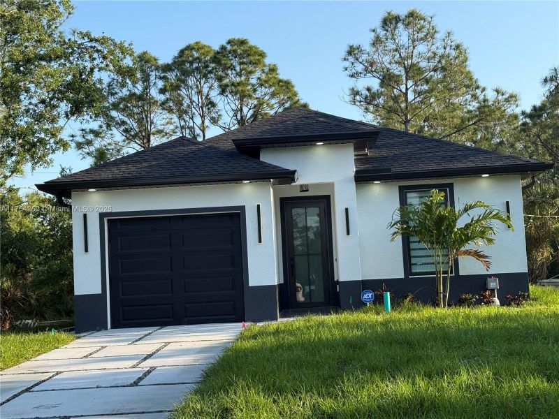 Front exterior of a new home in , Punta Gorda, FL, highlighting curb appeal (Image 22).
