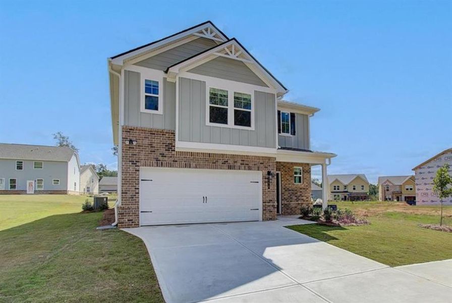 Front exterior of a new home in Westminster, Covington, GA, highlighting curb appeal (Image 14).
