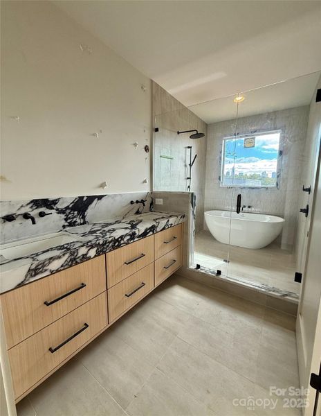 Primary bath - Full slab mirror and 36" sconces to be installed. Under cabinet lighting.