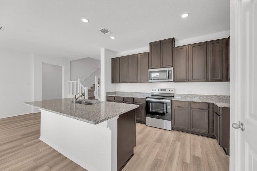 Furnished interior view inside a new home in Mustang Valley, Manor (Image 7). Furnished interior view inside a new home in Mustang Valley, Manor (Image 7).