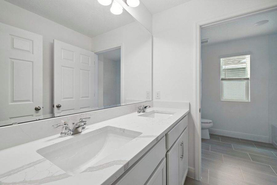 Representative furnished interior of a home built from the Wilshire Executive by Landsea Homes in Storey Creek, Kissimmee (Image 7).