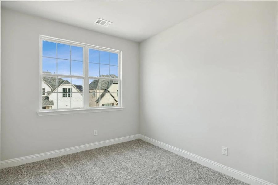 Empty room with carpet flooring