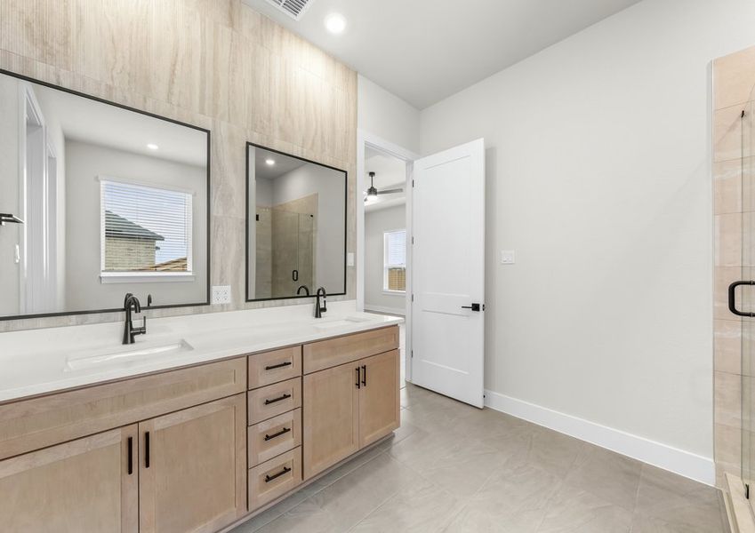 The master bathroom has a sprawling dual-sink vanity.
