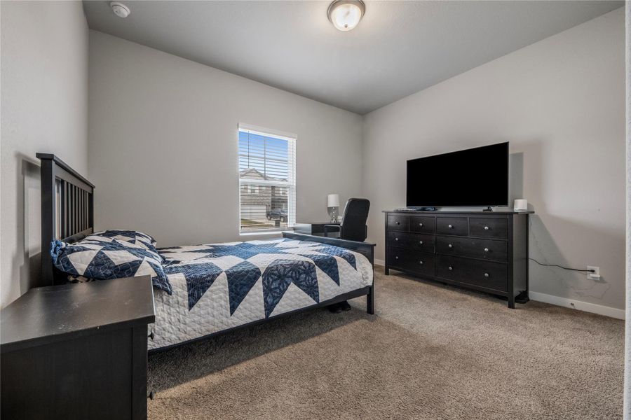 Comfortable secondary bedrooms offering versatility for family members, guests, home office, or hobby spaces. Each room is well-sized and designed with comfort in mind.