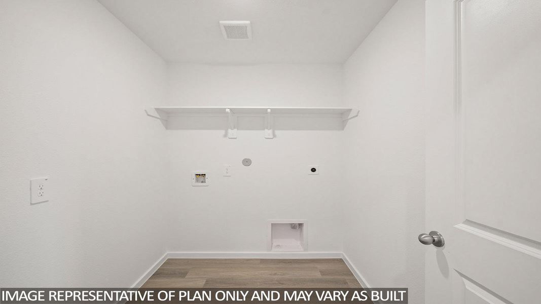 Laundry area with hookup for an electric dryer, light wood-style flooring, hookup for a washing machine, and gas dryer hookup