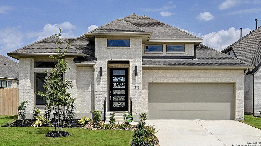 Front exterior of a new home in Stevens Ranch 55', San Antonio, TX, highlighting curb appeal (Image 27).