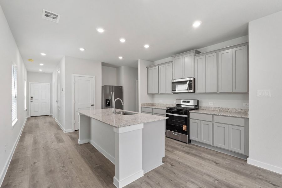 A kitchen with white cabinets. A kitchen with white cabinets.