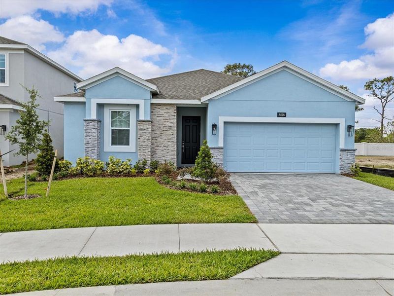 Front exterior of a new home in , Orlando, FL, highlighting curb appeal (Image 1).