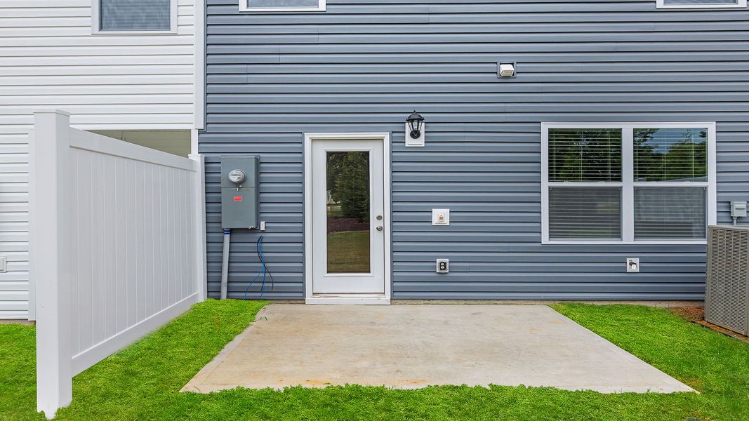 Exterior details and patio area of a home in Brookside Ridge Townhomes, Greer (Image 2).
