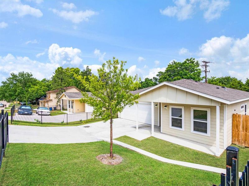 Front exterior of a new home in , Dallas, TX, highlighting curb appeal (Image 23).