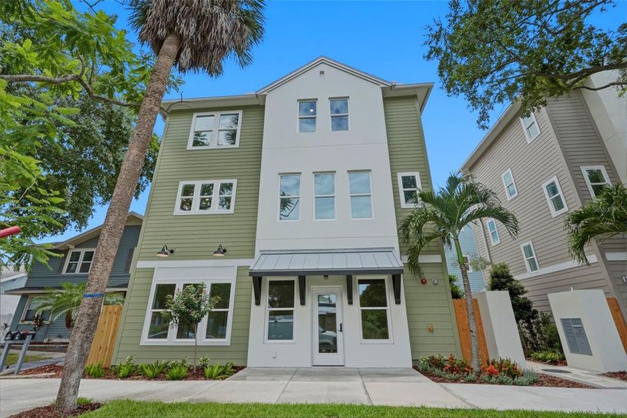Front exterior of a new home in , St. Petersburg, FL, highlighting curb appeal (Image 28).