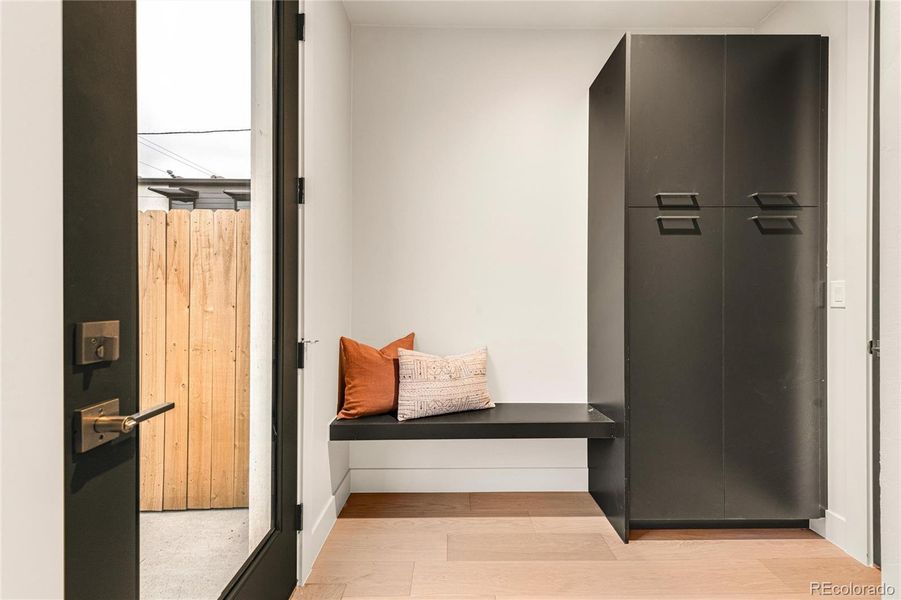 Mudroom at back entry with storage.