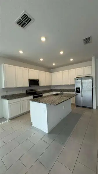 Furnished interior view inside a new home in Cypress Park Estates, Haines City (Image 2).
