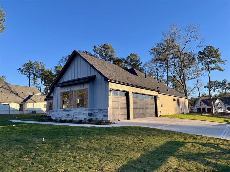 Large 3-car garage on corner beautiful corner homesite