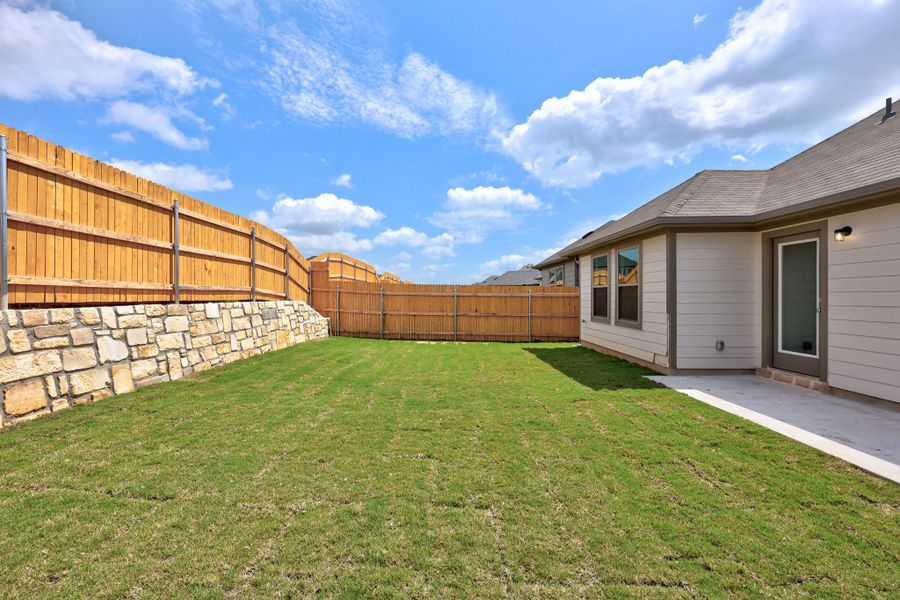 Exterior details and patio area of a home in Trinity Ranch, Elgin (Image 19).