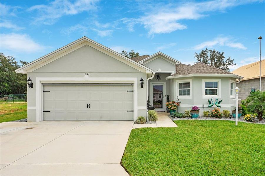 Front exterior of a new home in , Avon Park, FL, highlighting curb appeal (Image 1). Front exterior of a new home in , Avon Park, FL, highlighting curb appeal (Image 1).