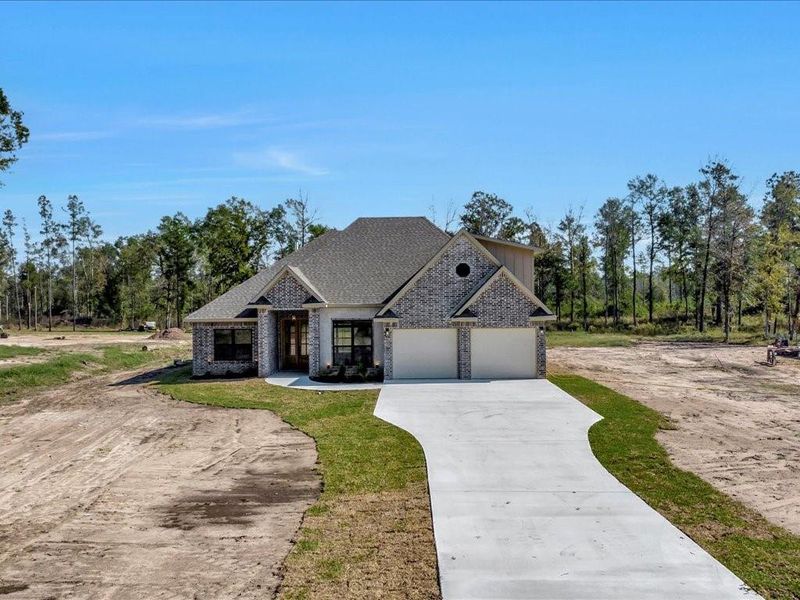 Front exterior of a new home in , Diboll, TX, highlighting curb appeal (Image 22). Front exterior of a new home in , Diboll, TX, highlighting curb appeal (Image 22).