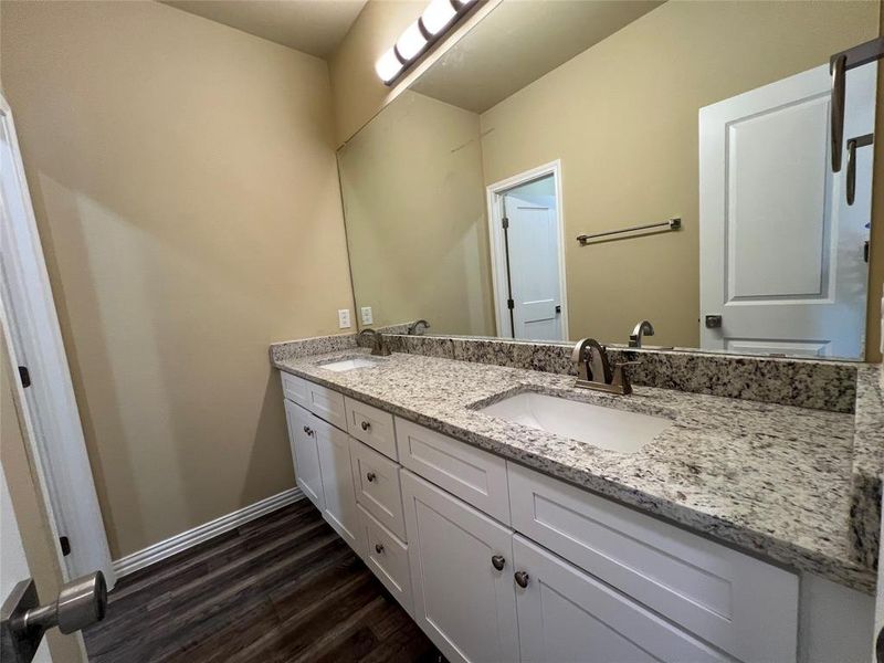 Full bathroom with double vanity, and separate Tile Surround Tub-Shower and Toilet room