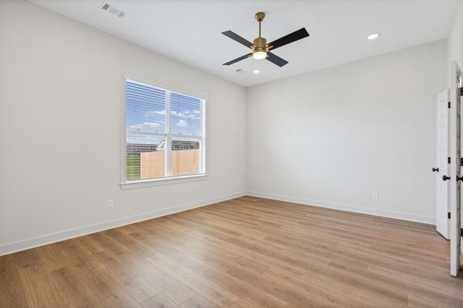 Spare room with light wood-style floors, ceiling fan, and recessed lighting
