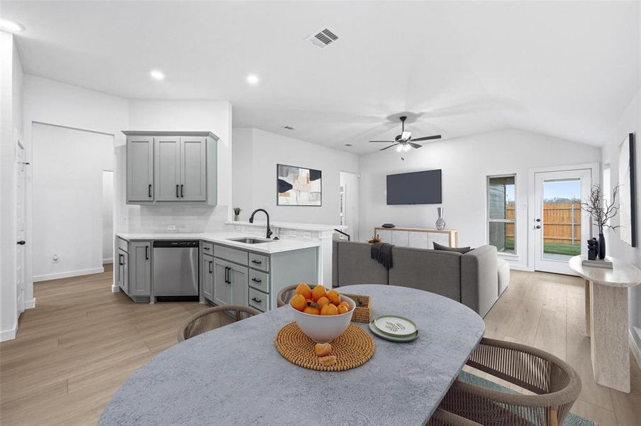 Virtually Staged kitchen with dining nook looking into living room Virtually Staged kitchen with dining nook looking into living room