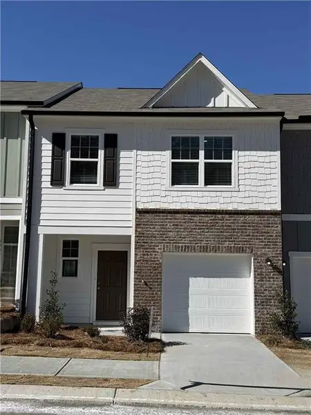 Front exterior of a new home in Kingston Cove, Auburn, GA, highlighting curb appeal (Image 6).