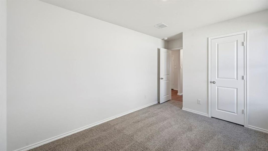 Unfurnished bedroom featuring carpet floors and baseboards Unfurnished bedroom featuring carpet floors and baseboards